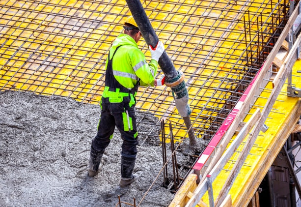 Worker Pouring Concrete